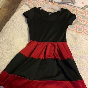 A lovely dress black top and red and black striped bottom
